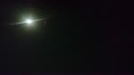 AEROPLANE FLYING AT NIGHT ON FULL MOON