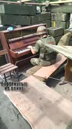 Playing sad tunes on piano during Donbass war