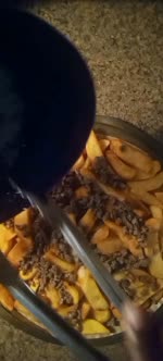 Assembling the nacho steak fries...